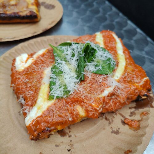 Square honey vodka sauce pizza slice